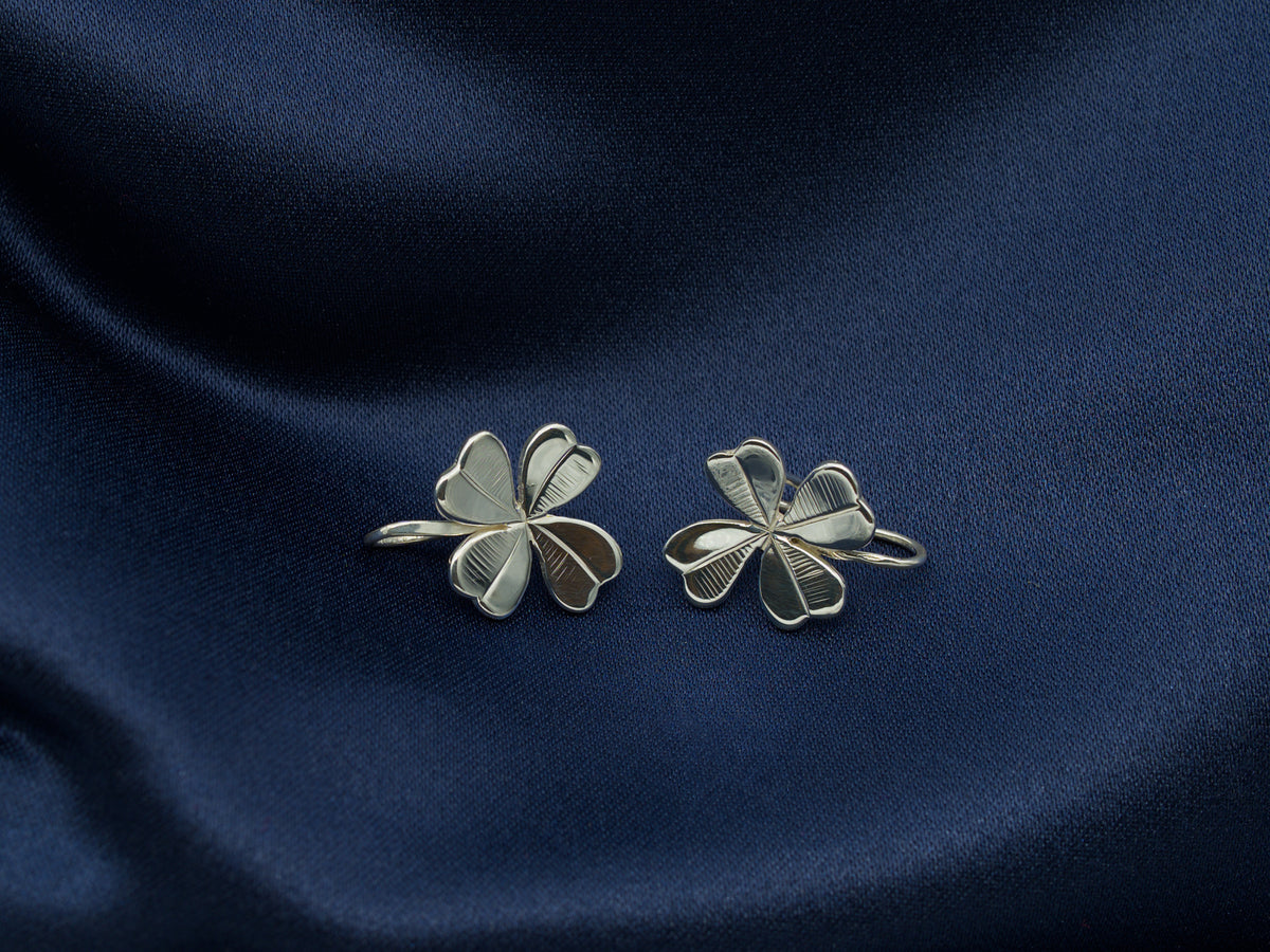 A pair of sterling silver four-leaf clover earrings
