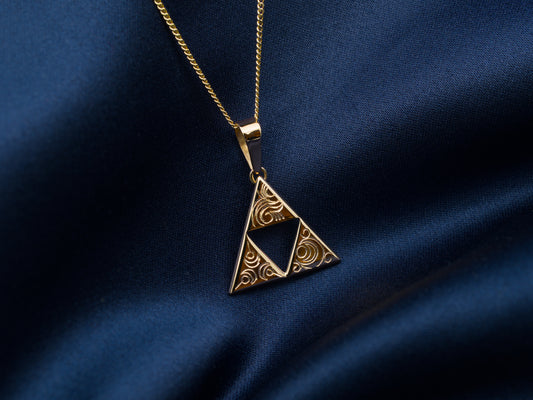 14 Karat gold triangle triforce necklace with swirl pattern engravings