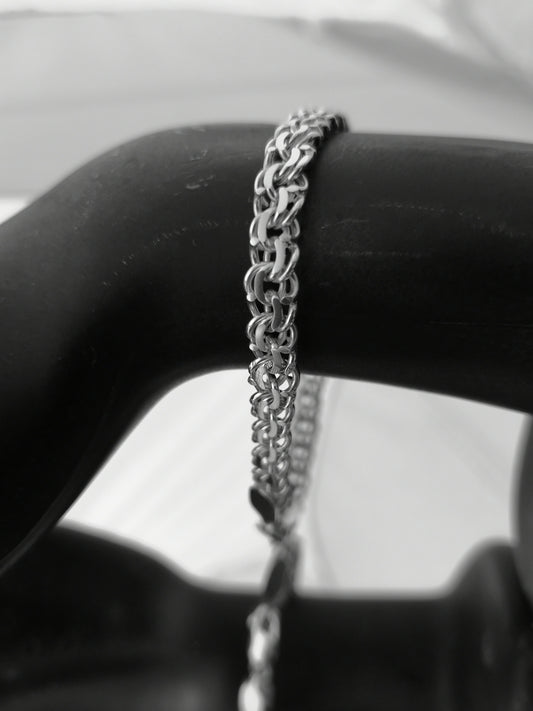 Hand-crafted Sterling Silver chain bracelet on a mannequin arm against a neutral background