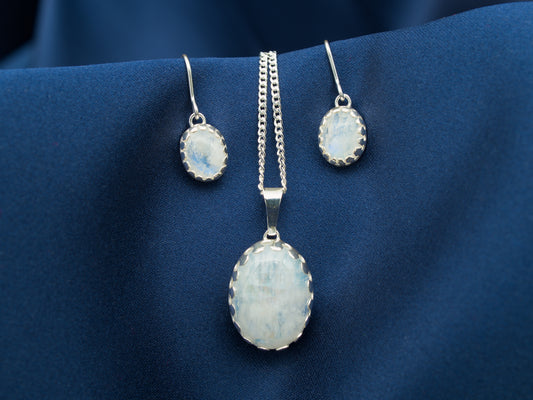 A set of sterling silver necklace and earrings with rainbow moonstone gems