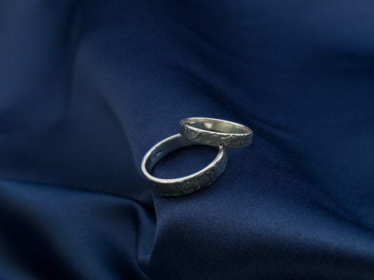 A pair of reticulated sterling silver rings
