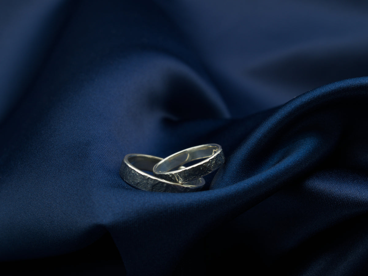 A pair of reticulated sterling silver rings