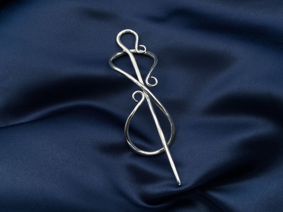 Sterling silver hair pin in the shape of the infinity symbol with a sterling silver needle