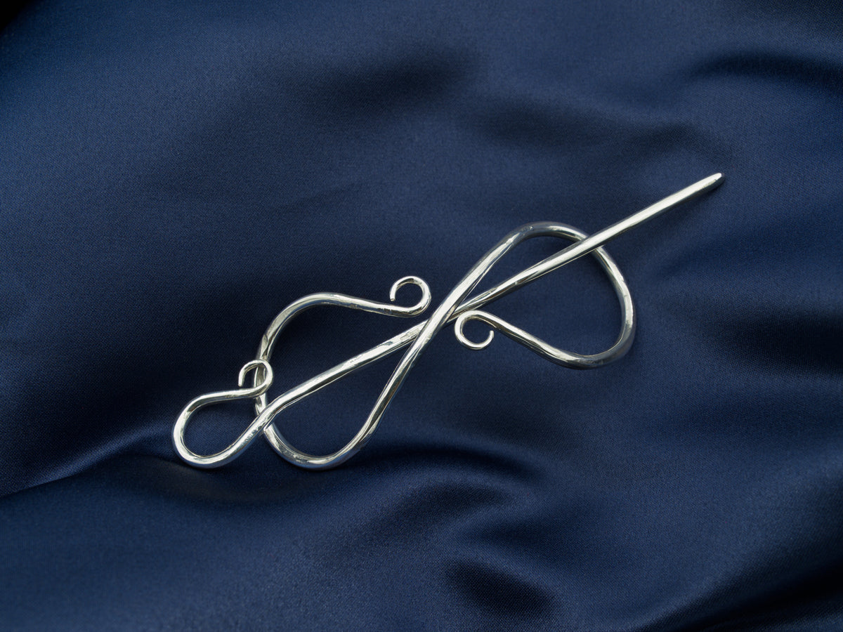 Sterling silver hair pin in the shape of the infinity symbol with a sterling silver needle