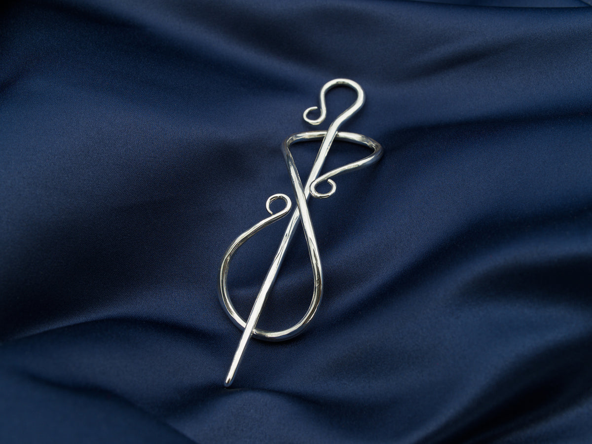 Sterling silver hair pin in the shape of the infinity symbol with a sterling silver needle