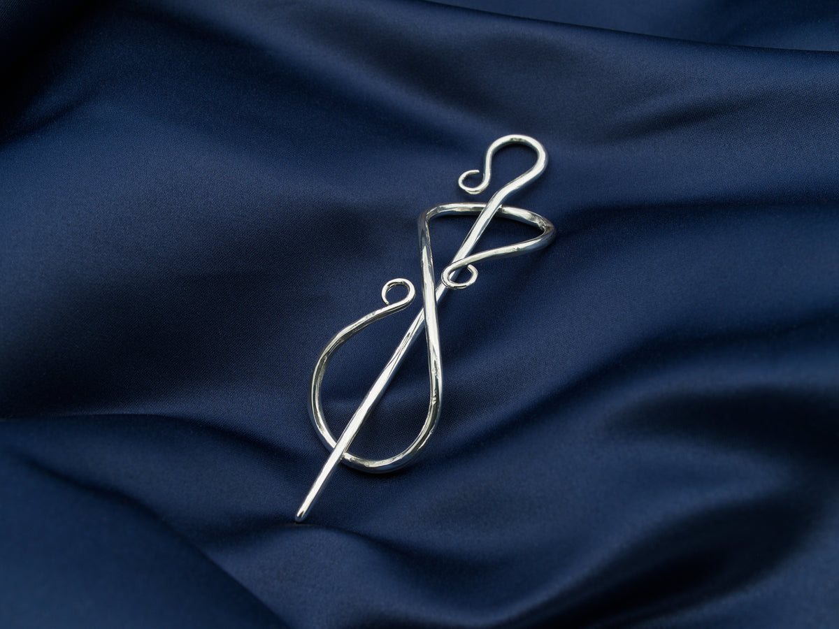 Sterling silver hair pin in the shape of the infinity symbol with a sterling silver needle