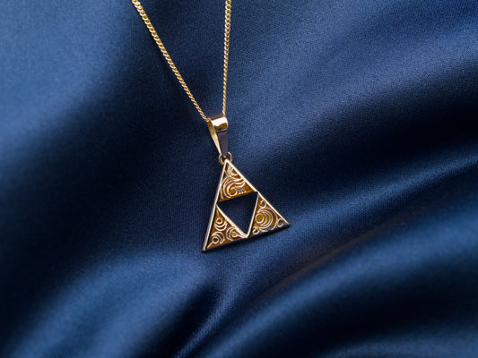 14 Karat gold triangle triforce necklace with swirl pattern engravings