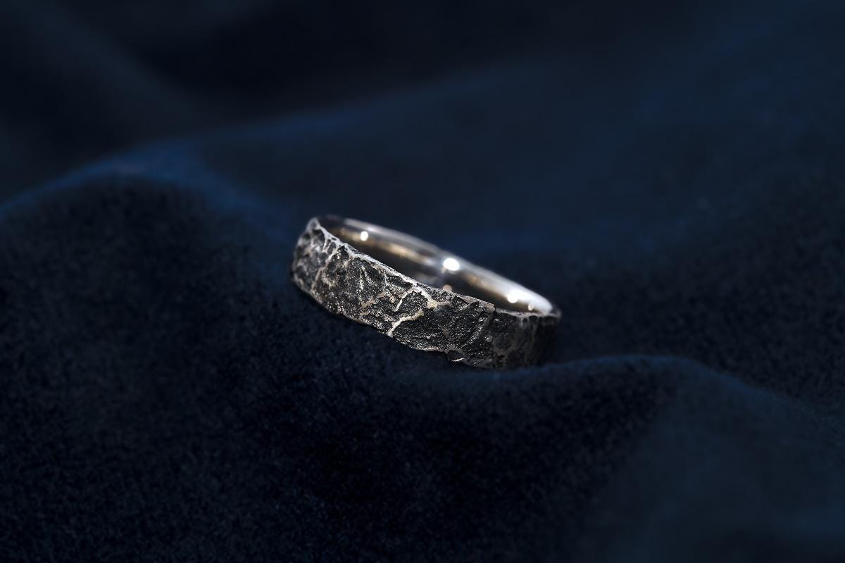 Reticulated Sterling Silver ring on a blue fabric background
